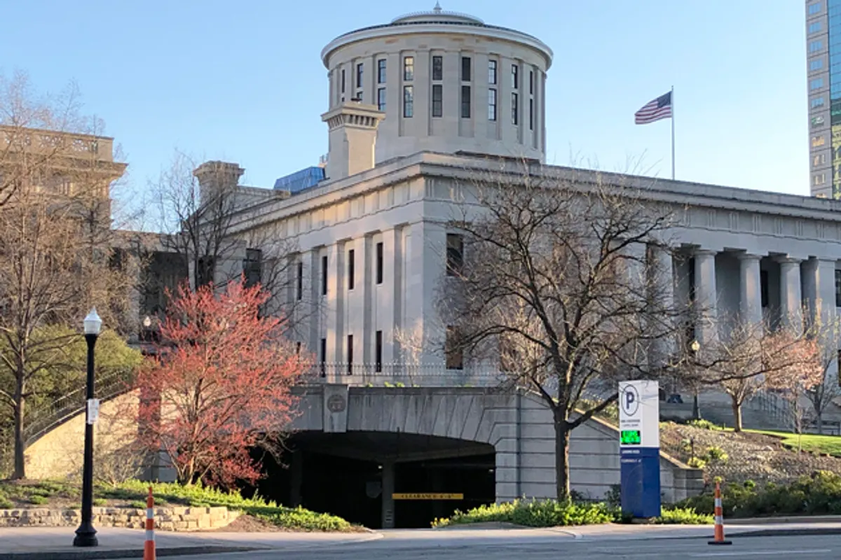 Ohio Statehouse exterior with columns and cupola on a clear day